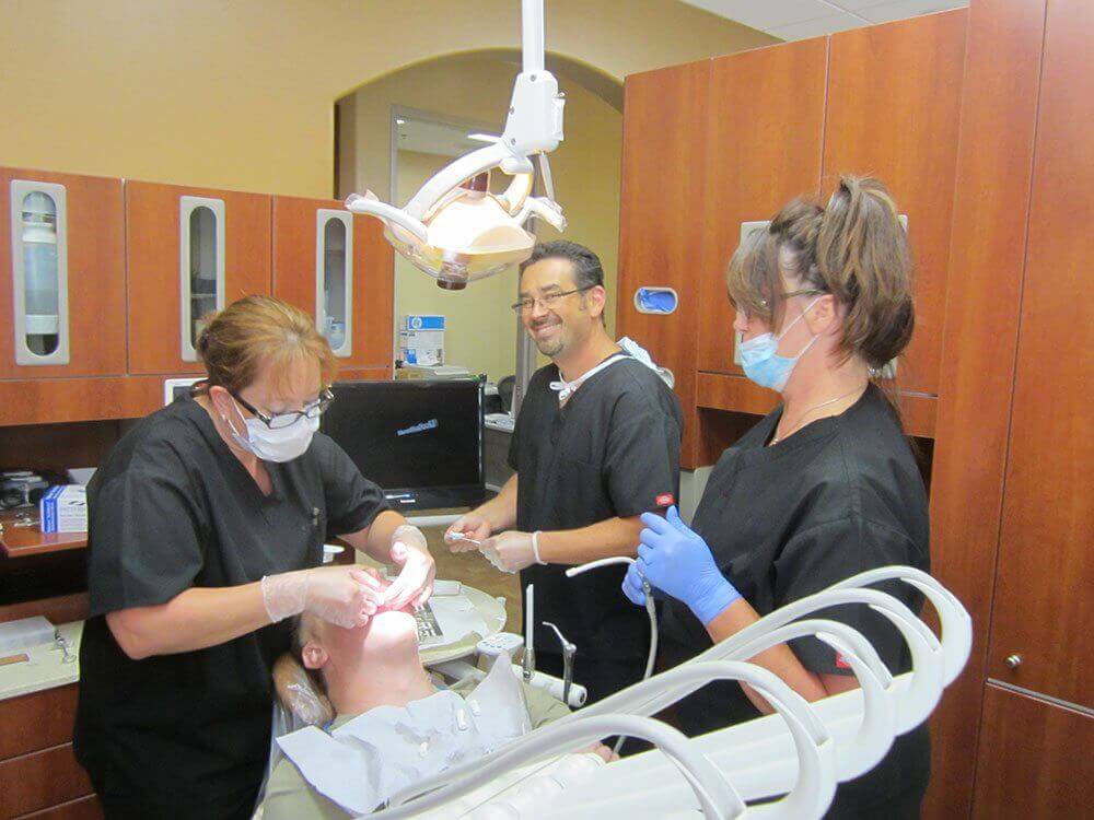 Dr. Derek B. Hauser, DDS, and his Registered Dental Assistants
